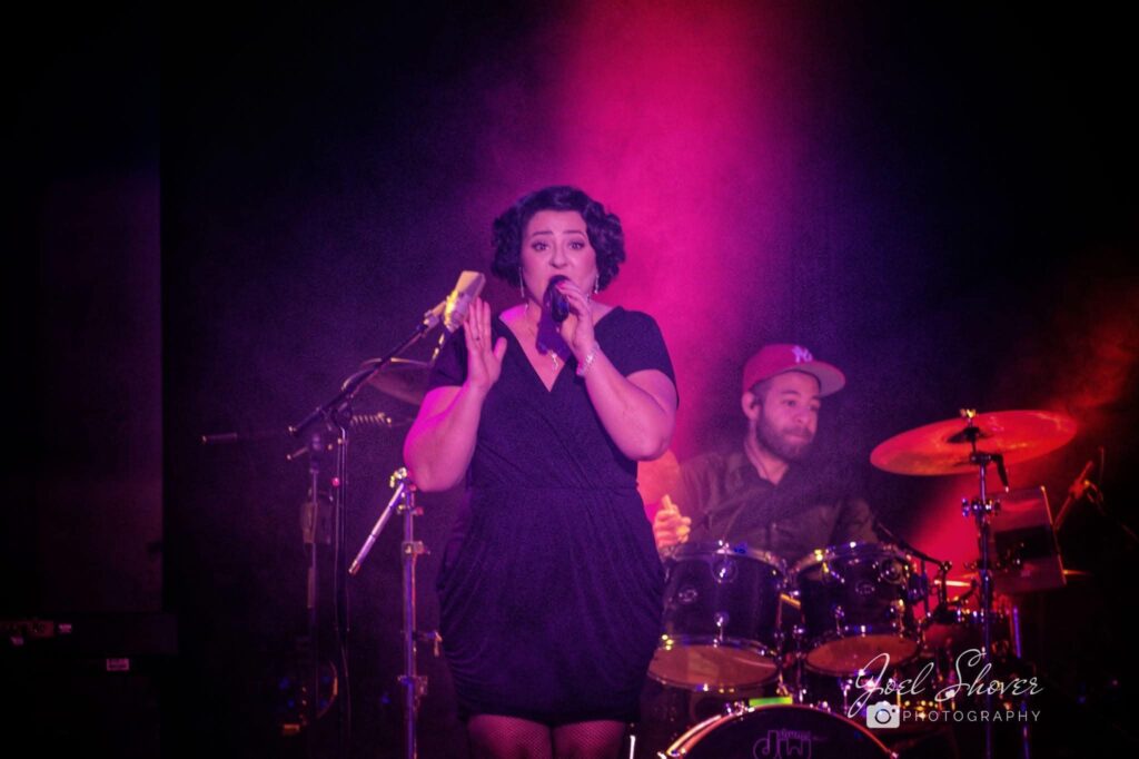 Deanna Maio performing at a gala event